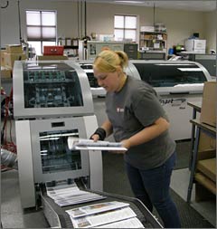 One of three IBIS Smart-binder Plus HS VDP saddle 
              stitchers cranking out LPi's church bulletins